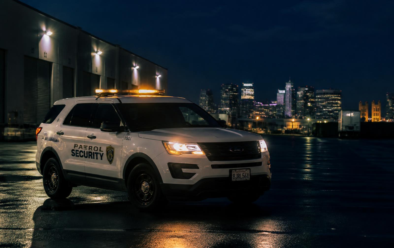 Marked security patrol vehicle on night patrol at a Sacramento commercial property